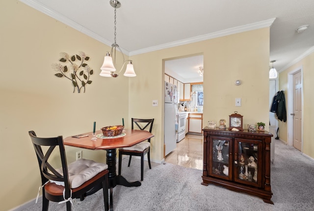 dining space with light carpet, baseboards, and crown molding