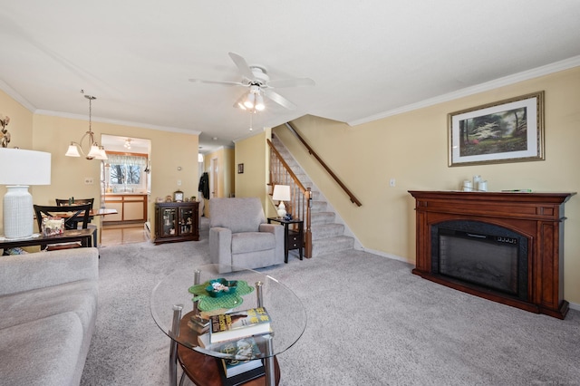 living area featuring carpet floors, stairway, and ornamental molding