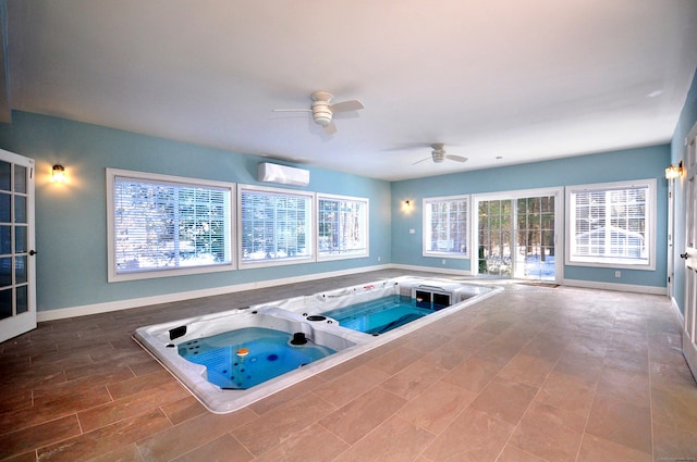 view of pool with an indoor in ground hot tub and a wall mounted AC