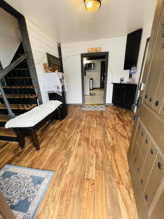 670 Wauregan Rd, Brooklyn, CT 06234 - corridor with wooden walls and light wood-type flooring