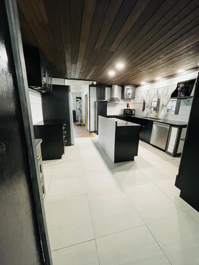 670 Wauregan Rd, Brooklyn, CT 06234 - kitchen with stainless steel dishwasher, wooden ceiling, dark cabinets, wall chimney exhaust hood, and light tile patterned floors