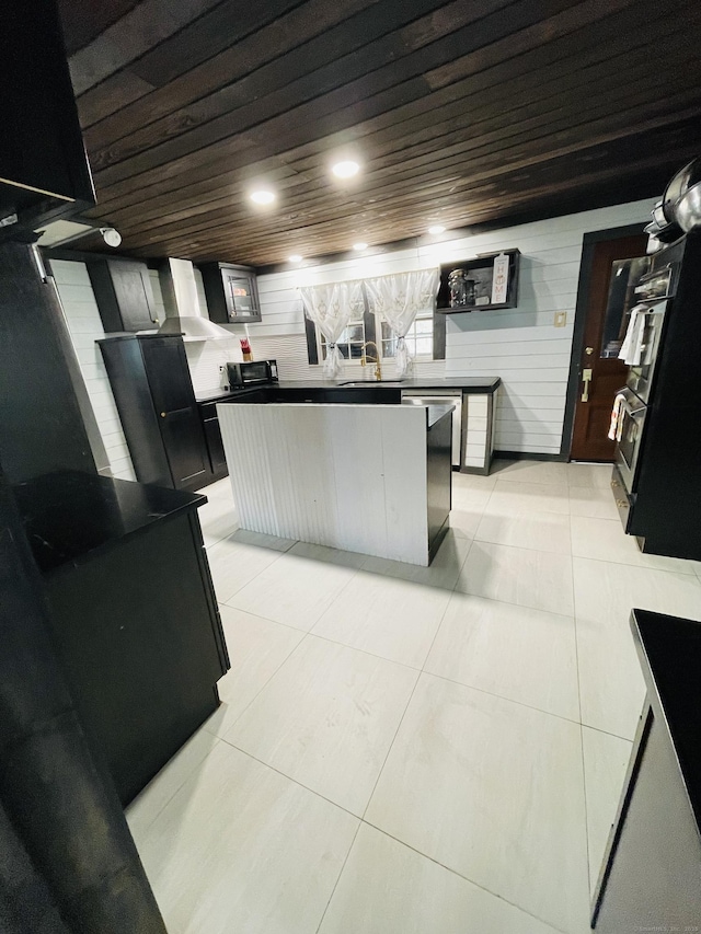 670 Wauregan Rd, Brooklyn, CT 06234 - kitchen with wood ceiling, dark countertops, light tile patterned floors, a center island, and a sink