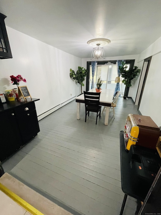 670 Wauregan Rd, Brooklyn, CT 06234 - dining area featuring baseboard heating, hardwood / wood-style flooring, and a chandelier