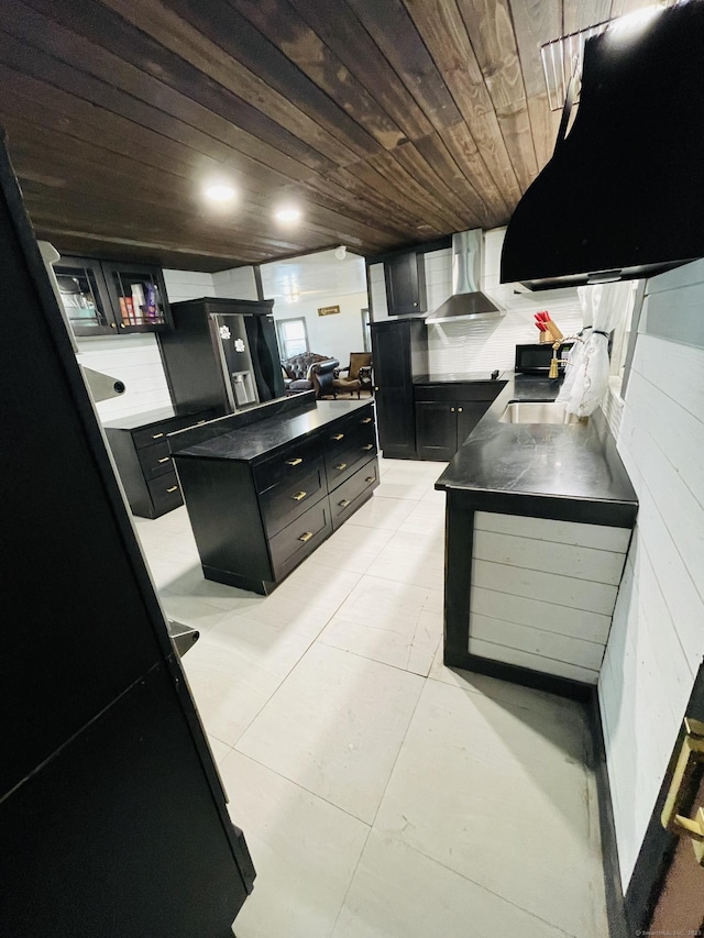670 Wauregan Rd, Brooklyn, CT 06234 - kitchen with wall chimney range hood, dark cabinets, wood ceiling, a center island, and a sink