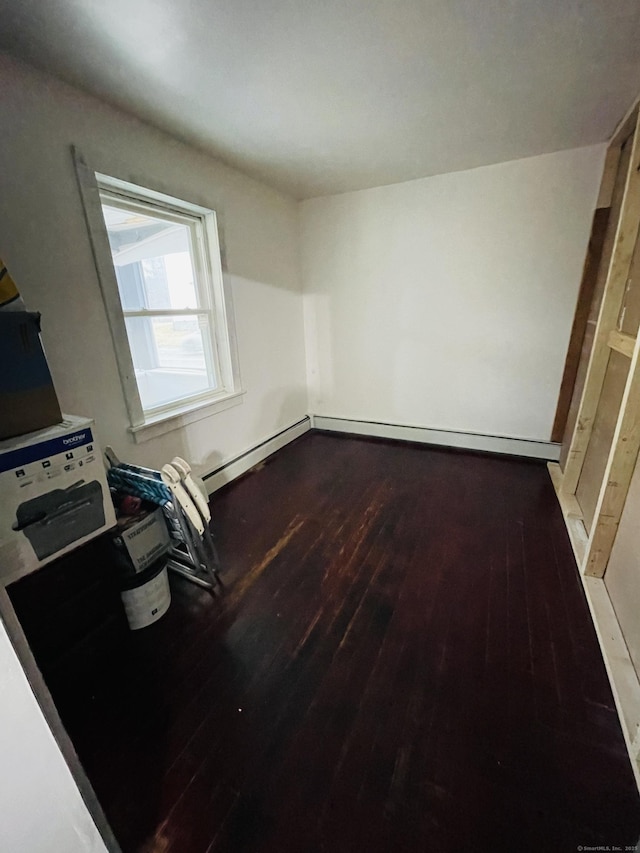 670 Wauregan Rd, Brooklyn, CT 06234 - unfurnished bedroom featuring hardwood / wood-style flooring and a baseboard heating unit