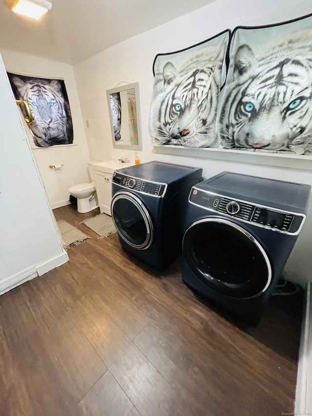 670 Wauregan Rd, Brooklyn, CT 06234 - washroom with dark wood-style flooring and washer and dryer