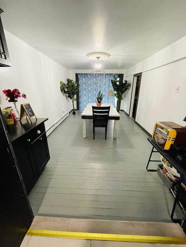 670 Wauregan Rd, Brooklyn, CT 06234 - dining space with a baseboard radiator and light wood-type flooring