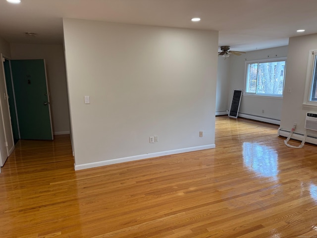 empty room featuring light wood-style flooring, baseboards, ceiling fan, and recessed lighting