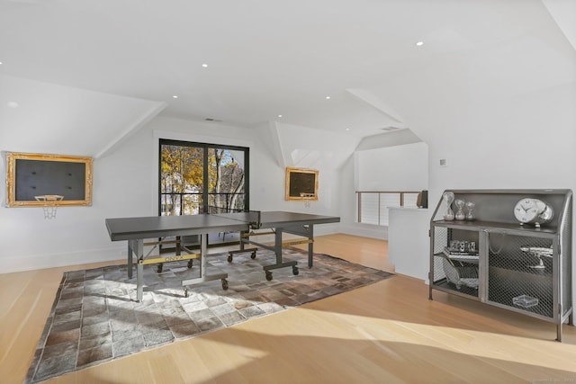 home office featuring lofted ceiling, baseboards, wood finished floors, and recessed lighting