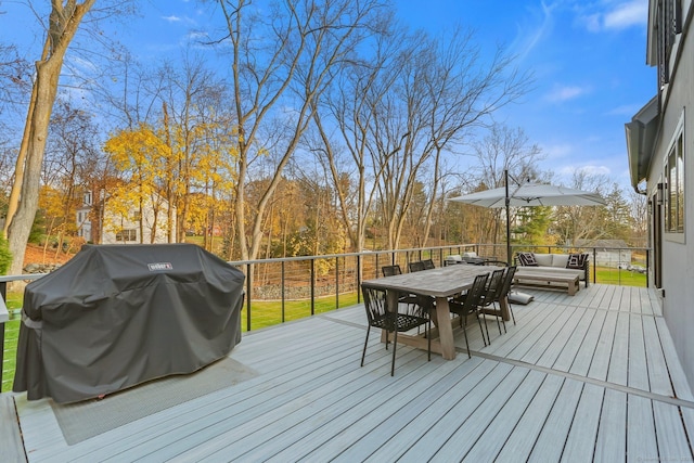 wooden terrace with outdoor dining area, a grill, and an outdoor hangout area