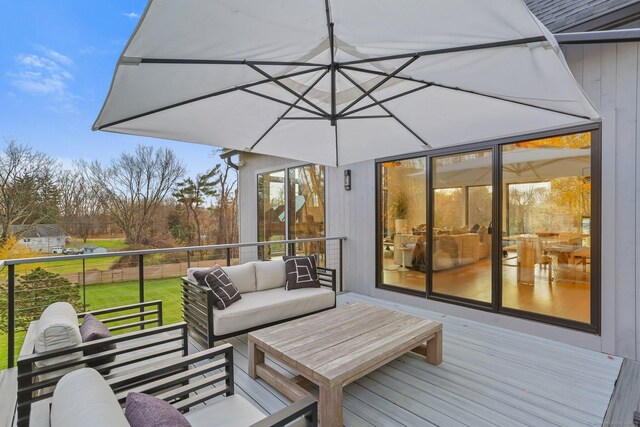 wooden deck with an outdoor living space