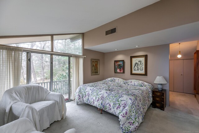 bedroom featuring light carpet, access to exterior, visible vents, and vaulted ceiling