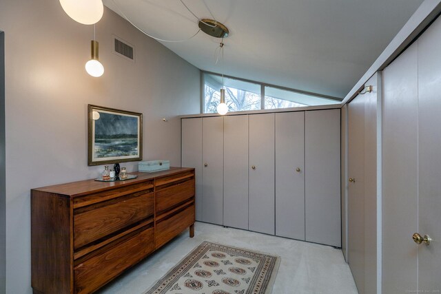 bedroom featuring visible vents and vaulted ceiling