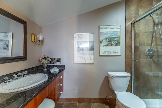 full bathroom with tiled shower, lofted ceiling, toilet, tile patterned flooring, and vanity