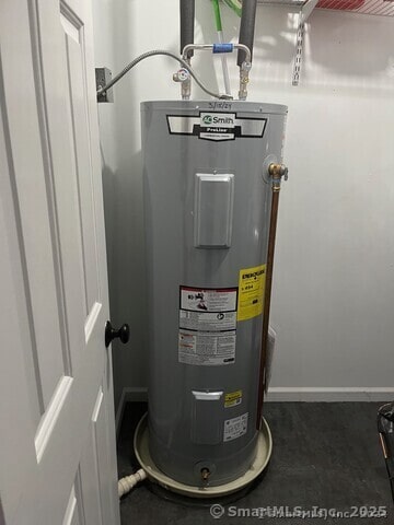 utility room with electric water heater