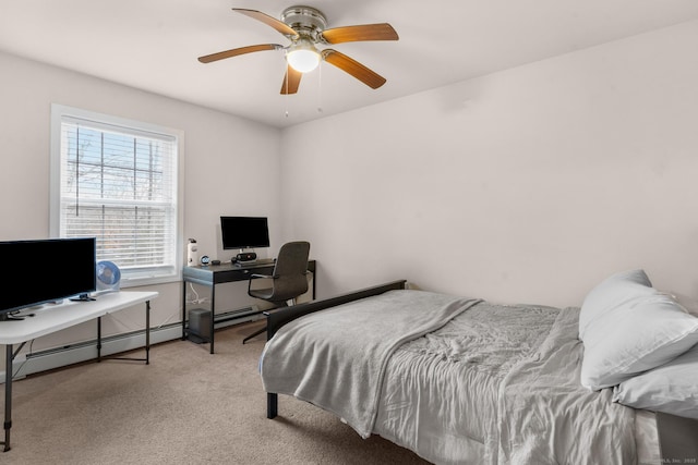 carpeted bedroom featuring a baseboard heating unit and a ceiling fan