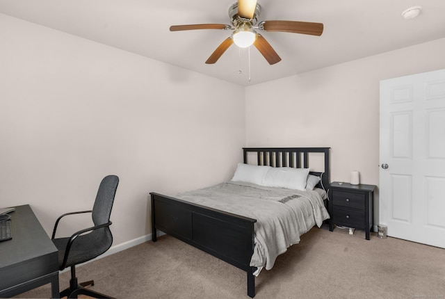 bedroom featuring baseboards, a ceiling fan, and carpet flooring