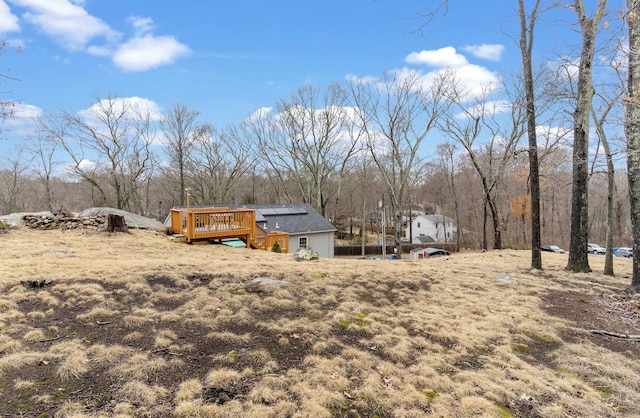 back of house with a wooden deck