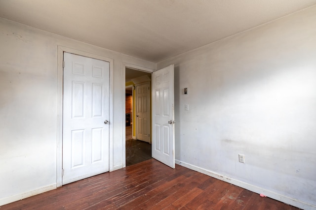 interior space featuring hardwood / wood-style floors and baseboards