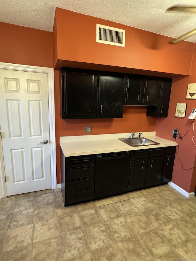 kitchen with a sink, visible vents, light countertops, dark cabinetry, and dishwasher