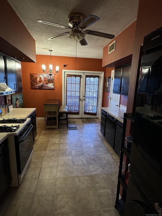 kitchen featuring light countertops, visible vents, dishwasher, and gas range