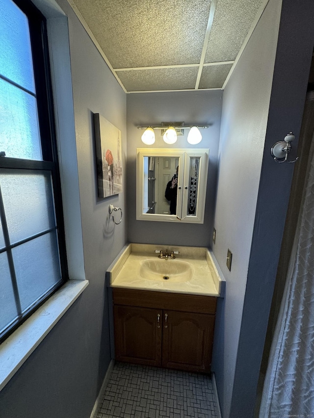 bathroom with vanity and baseboards