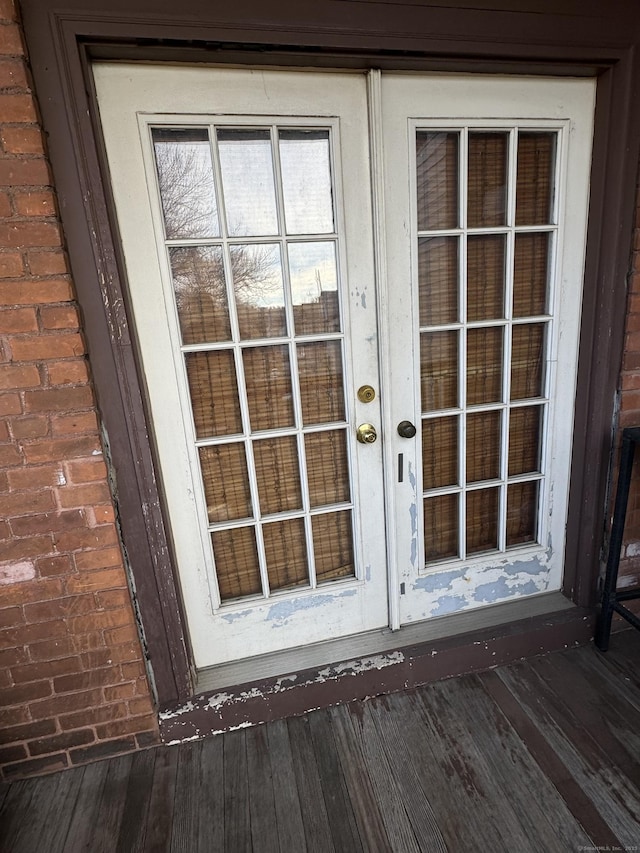 doorway to property with french doors and brick siding