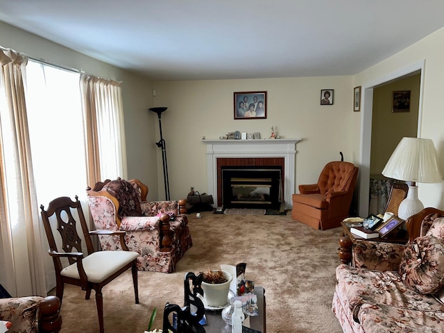 living room featuring carpet and a fireplace