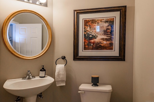 bathroom featuring a sink and toilet