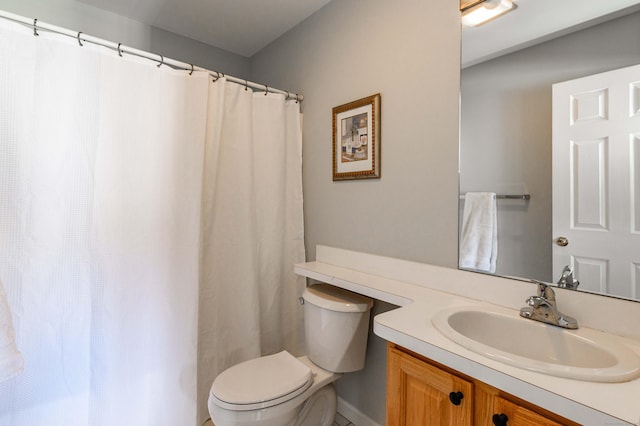 full bathroom featuring toilet and vanity