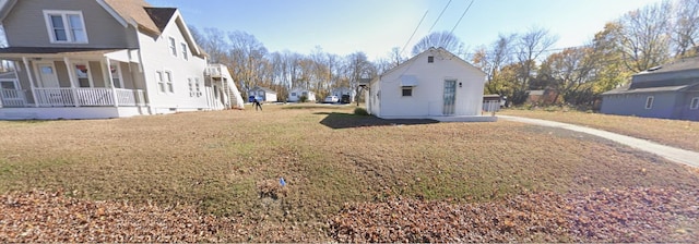 view of side of home with a residential view, covered porch, a lawn, and crawl space