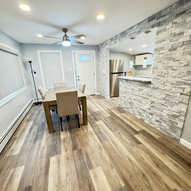 dining space featuring baseboards, a baseboard radiator, ceiling fan, light wood-type flooring, and recessed lighting