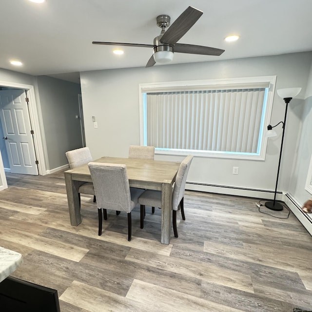 dining area featuring wood finished floors, a ceiling fan, and recessed lighting