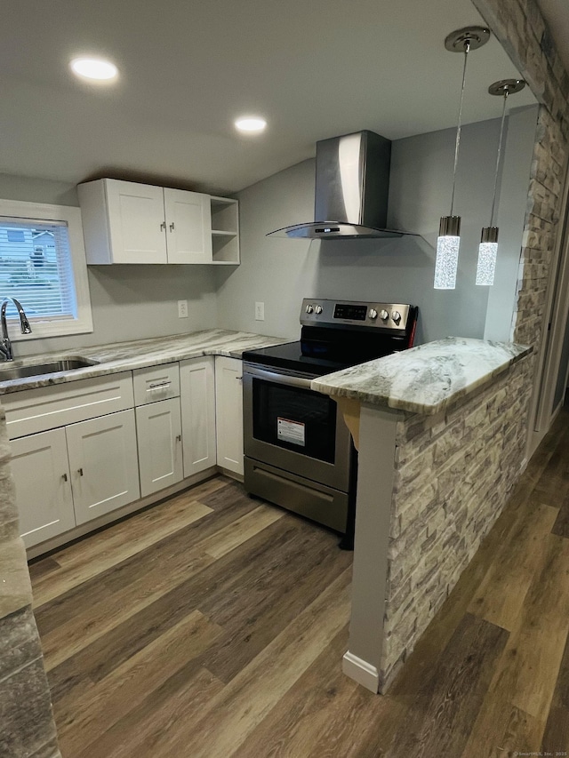 kitchen featuring electric range, dark wood-style flooring, wall chimney range hood, white cabinetry, and a sink
