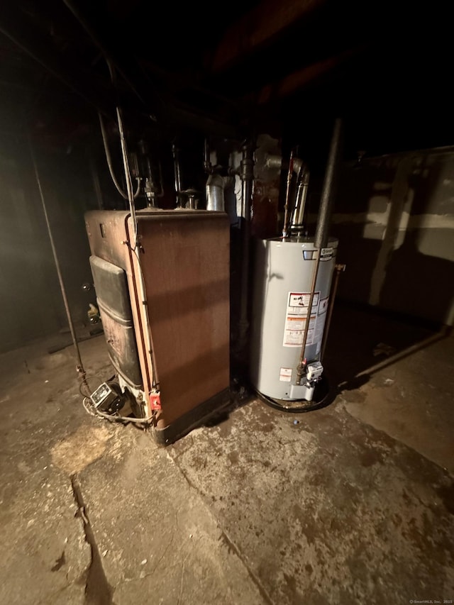 utility room featuring gas water heater