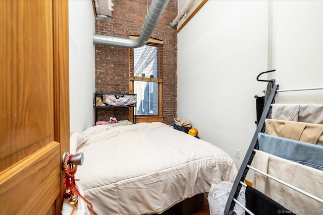 bedroom with brick wall