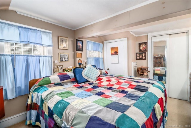 bedroom featuring ornamental molding and a closet