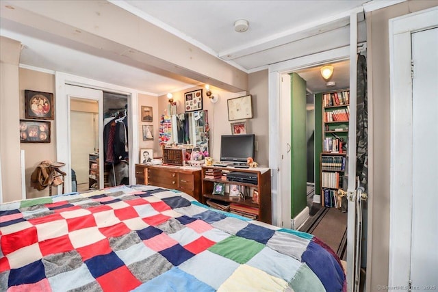 bedroom featuring a closet and crown molding