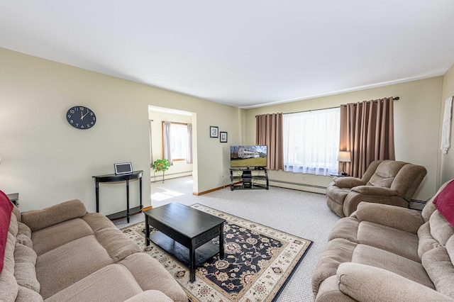 carpeted living room with a baseboard heating unit, a wealth of natural light, and baseboards