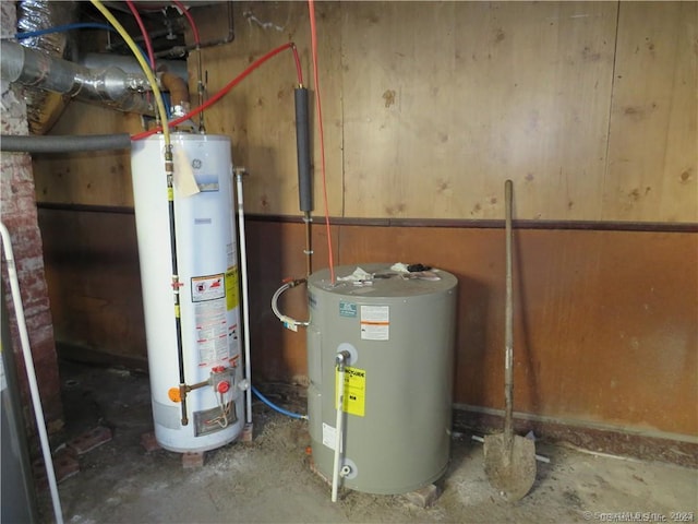 utility room featuring water heater