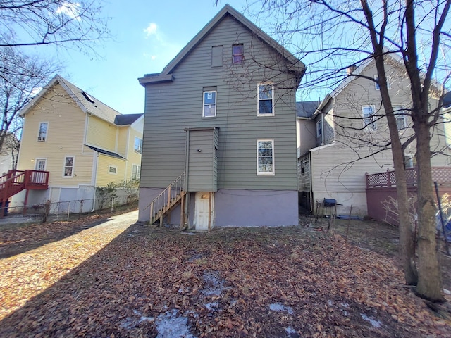 rear view of property with fence