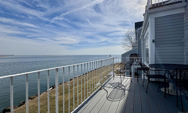 wooden deck with a water view