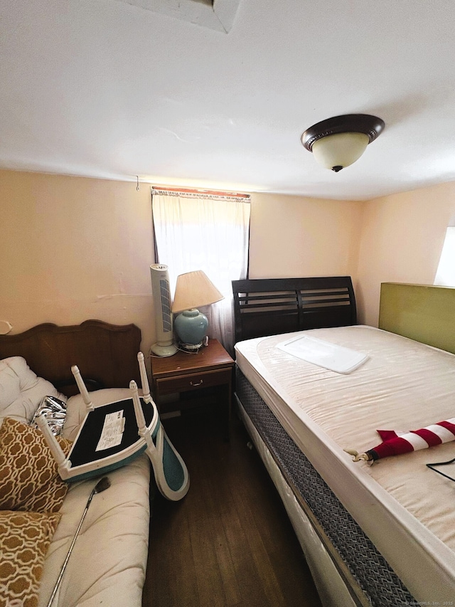 bedroom with wood finished floors