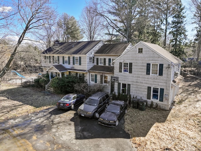 view of front of house featuring a chimney