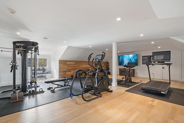 exercise room featuring recessed lighting, visible vents, and wood finished floors