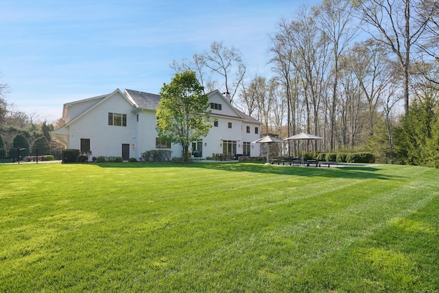 exterior space with a yard and fence