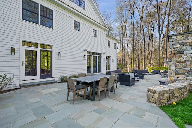 view of patio featuring an outdoor living space and outdoor dining area