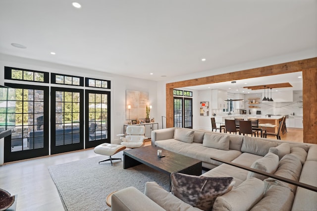 living area featuring recessed lighting and light wood-style flooring