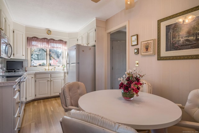 dining area featuring light wood-type flooring