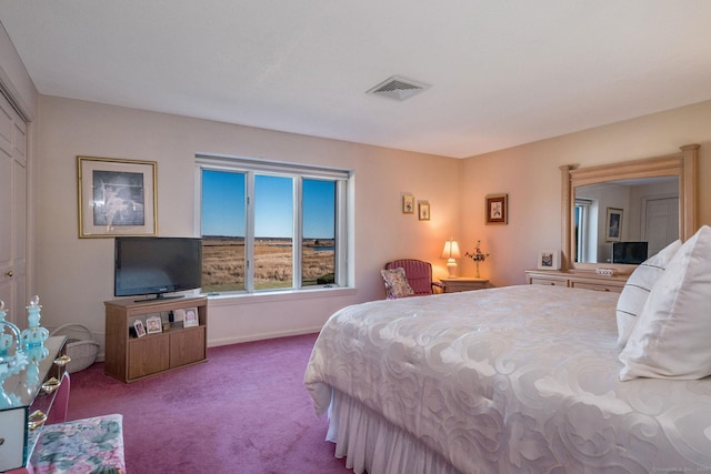 bedroom with visible vents, carpet flooring, and baseboards